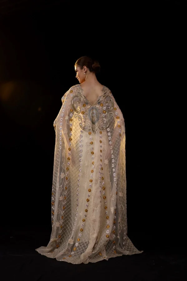 A SHEER NECK, FLOOR-LENGHT EMBROIDERED GOWN CAPE DRAPES FROM THE SHOULDERS - Image 5